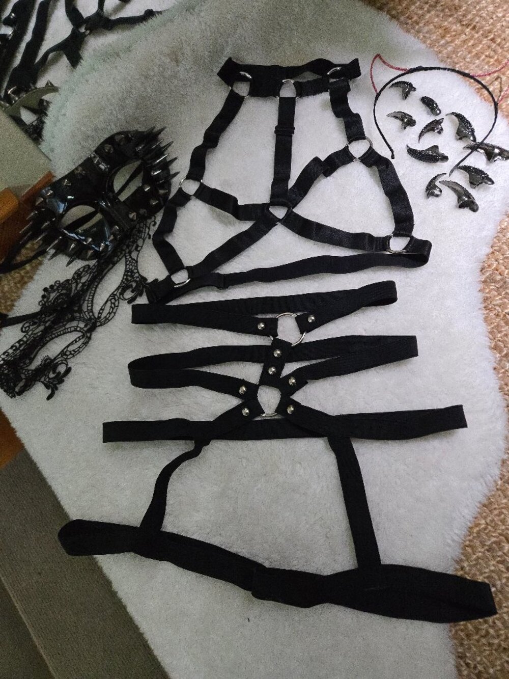 Black bondage harness, masks, and inclusions costume